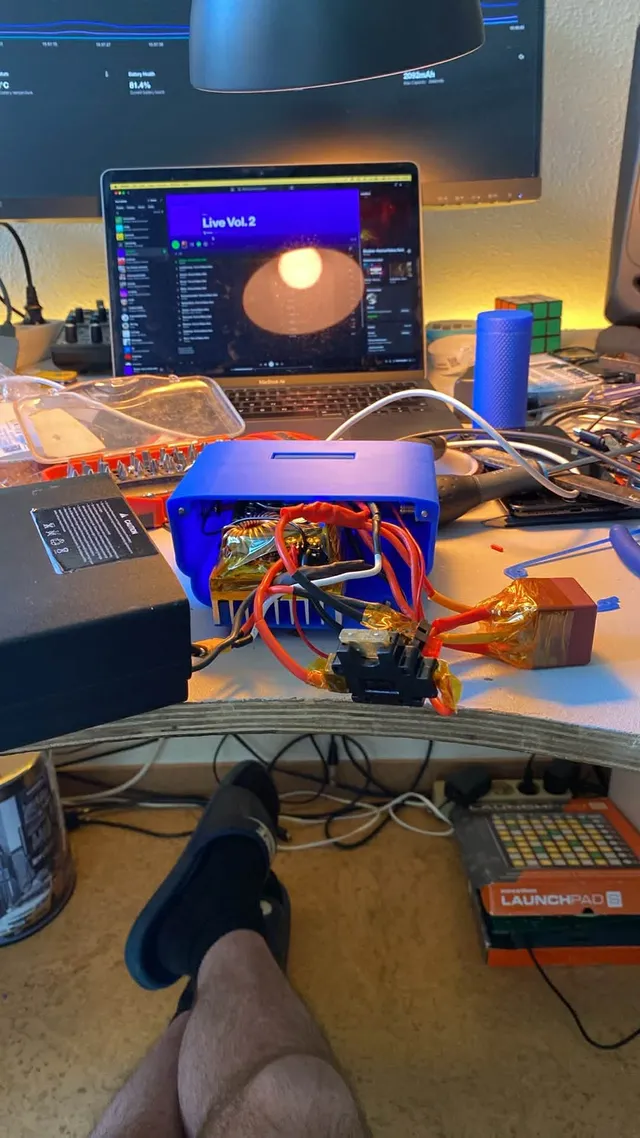 The module on the workbench with its internal wiring, buck-converter, kill-switch relay and fused connections visible during assembly.