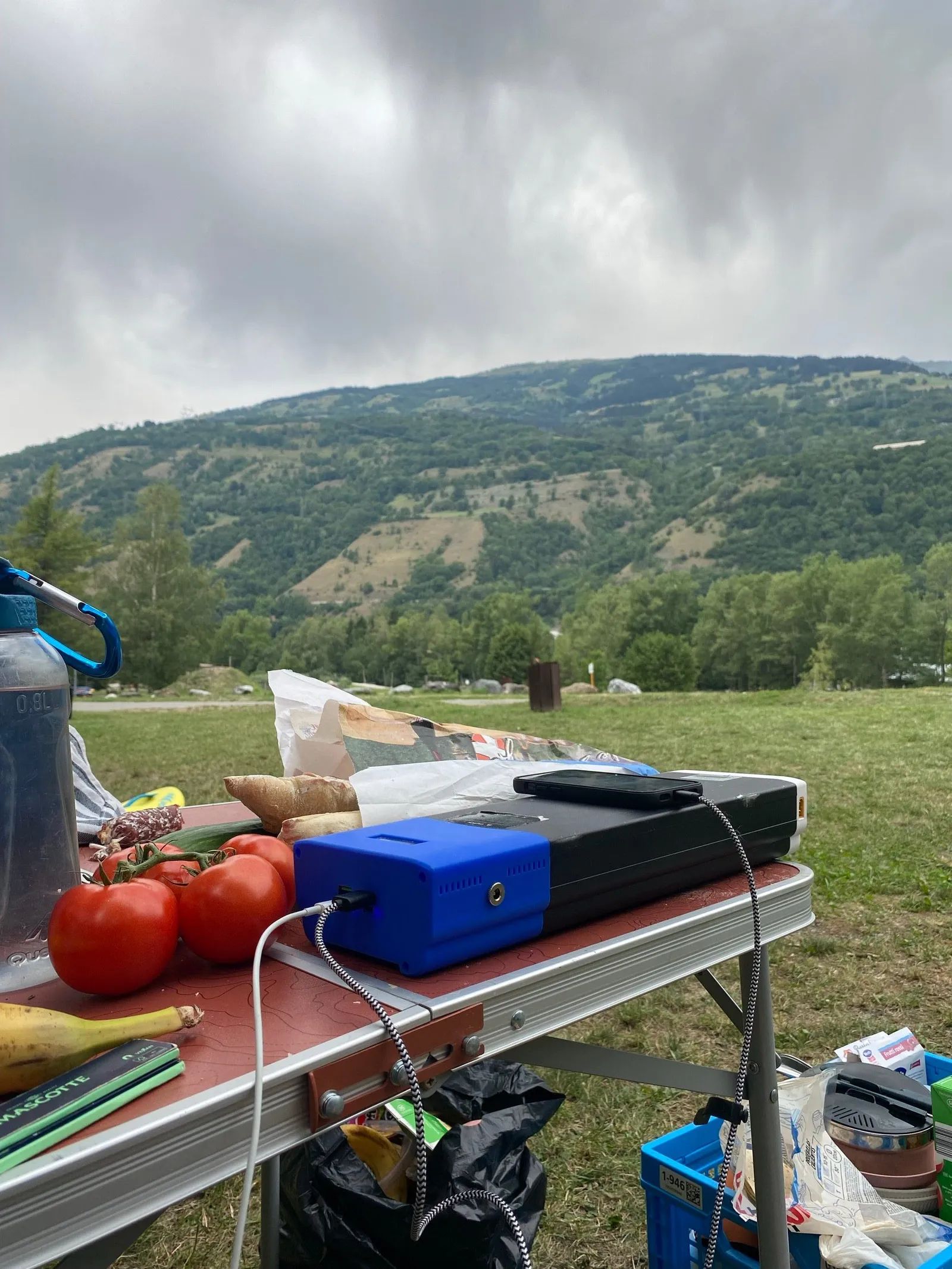 The power station charging a phone on a real world camping test.