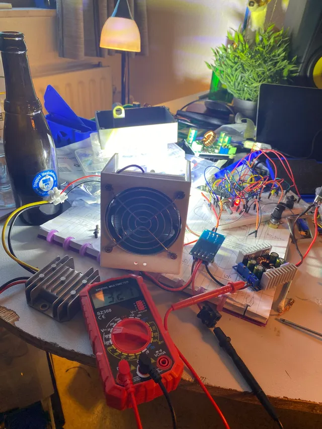 The first time the led light is powered on and glowing brightly on the workbench with breadboard prototype, while setting the maximum current with a multimeter.